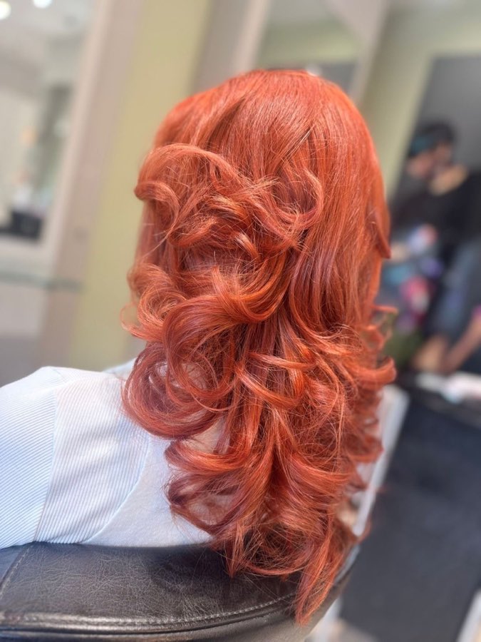 Bright copper colour with bouncy curls, by Replay Hair & Beauty