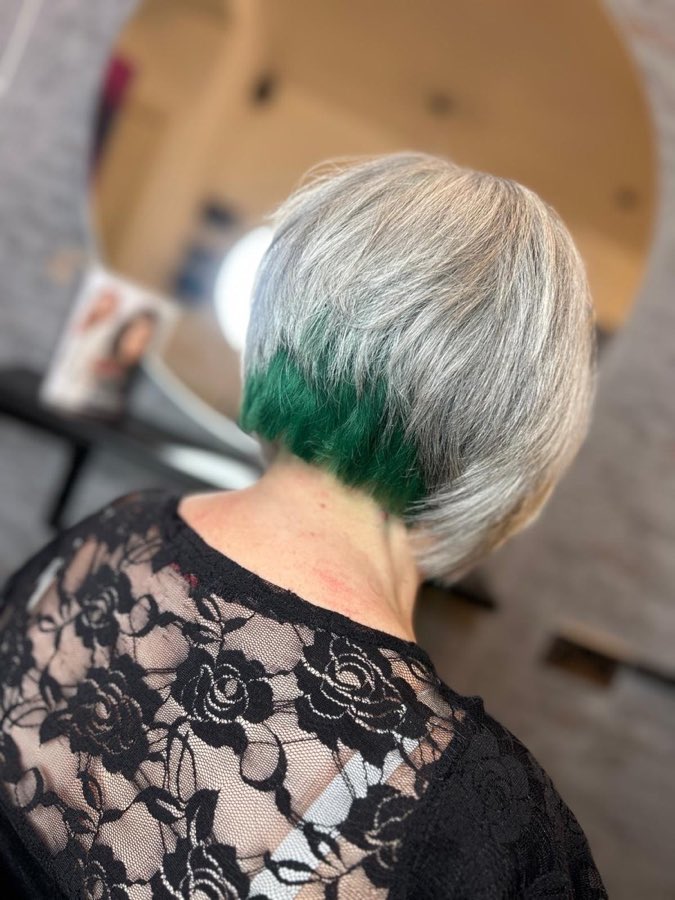Silver bob with a hidden emerald-green underlayer, by Replay Hair & Beauty